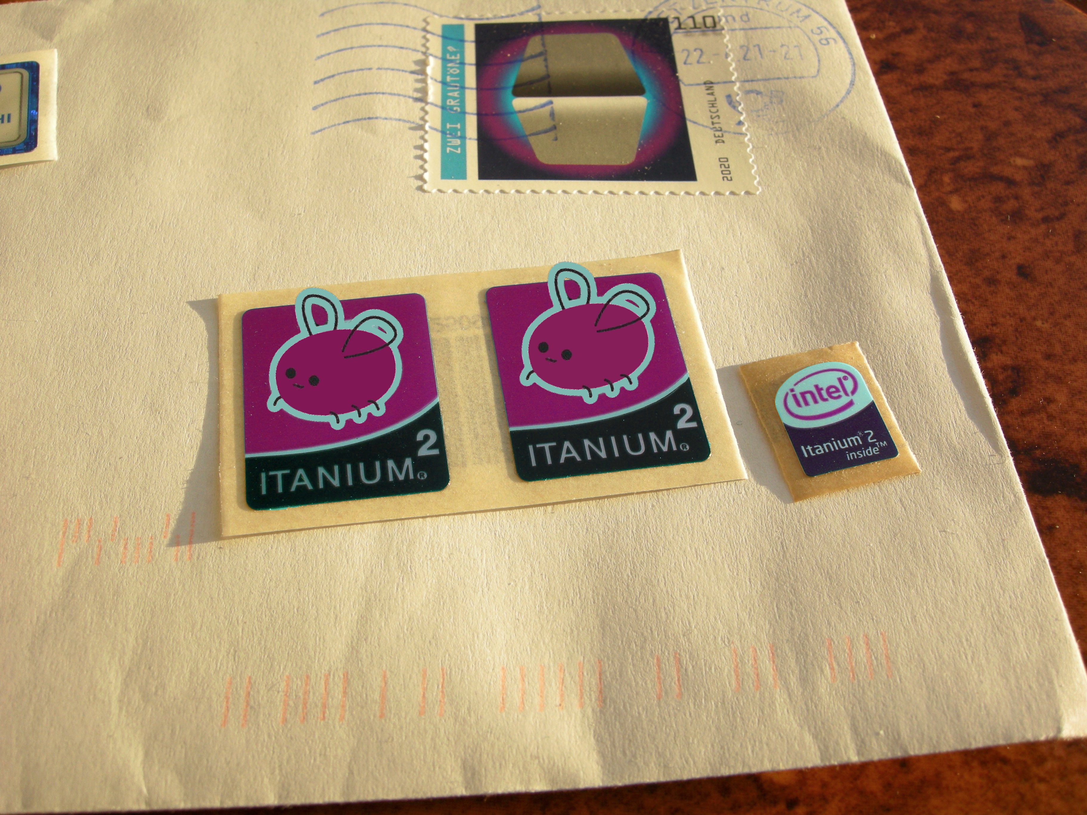 intel inside itanium 2 stickers poorly colour-shifted to cohost-purple and eggbugs over-laid atop the intel branding
