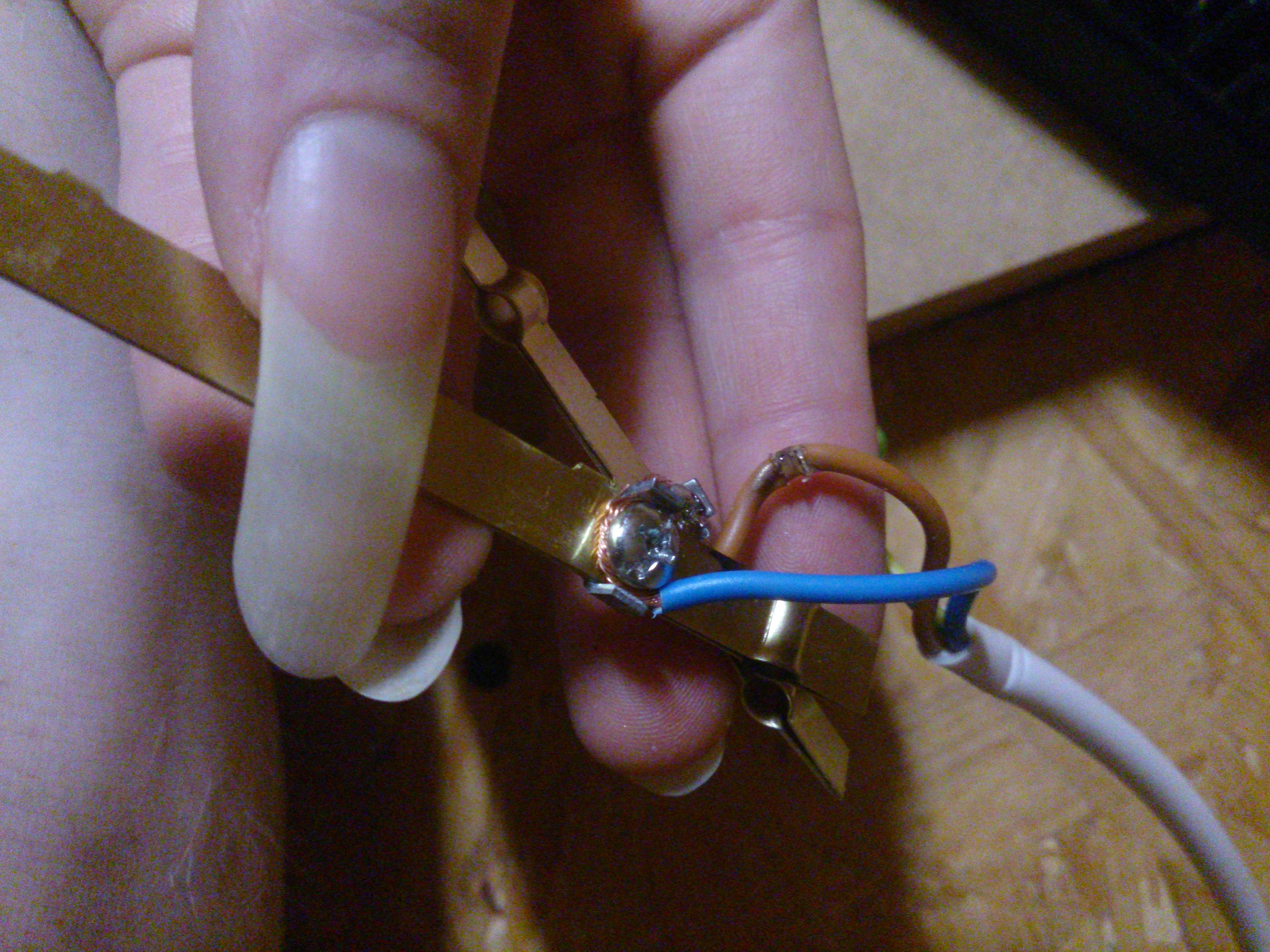 the culprit, extracted; a nice metallic sheen is visible, blown out of the insulation at like 2mm' length of the conductor fun!