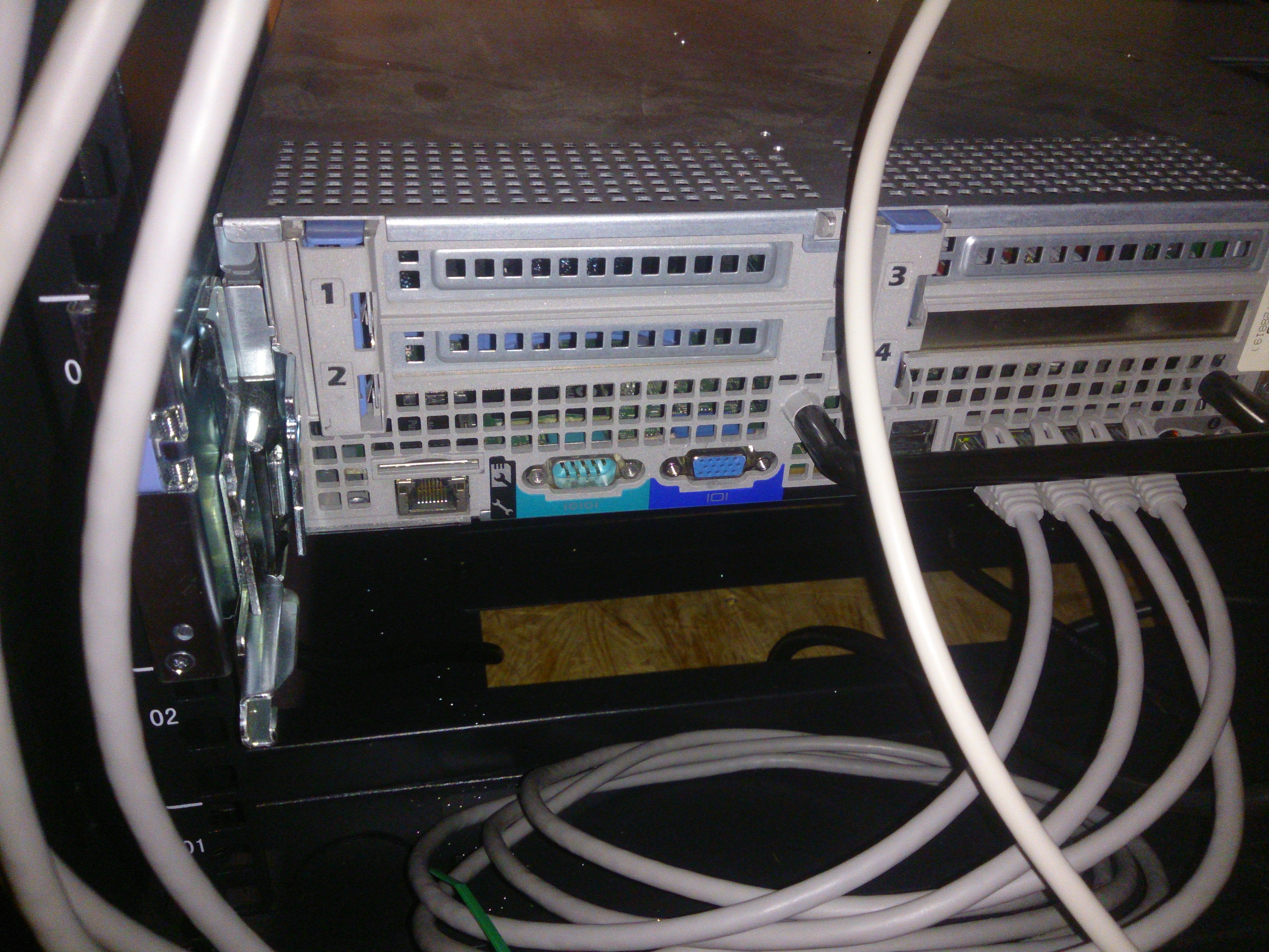 Back of the R710; visible are the iDRAC RJ45, VGA, and one DB9 in RS232 marked IOIOI